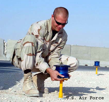 Airman installs light