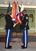 Command Sgt. Maj. Michael E. Williams, Support Troops Battalion, Third Army/ARCENT, is presented a folded American flag during his retirement ceremony where he also received the Legion of Merit award, Dec 8, at the Carolina Skies Club. Williams is retiring after 30 years of military service. Photo by Sergeant 1st Class Tony J. Spain, Third Army/ARCENT Public Affairs Office.