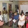 U.S. Senate staffer Shannon Smith, in blue, gets a firsthand view of PEPFAR-supported OVC programs during a visit to Cote d’Ivoire, with (at her left) PEPFAR Cote d’Ivoire Coordinator Jyoti Schlesinger and National OVC Program Director Dr. Clementine Koua-Anderson. At the back is CDC Chief of Party Dr. Bruce Struminger.
