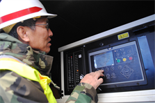 Elton Choy, an electrical engineer with the U.S. Army Corps of Engineers New York Recovery Field Office, checks the status of a generator, Dec. 13, 2012. Choy, from the Honolulu District, is one of more than 150 Corps of Engineers volunteers from around the U.S. helping New York recover.