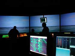 Photo showing the inside of FutureFlight Central's Air Traffic Control Tower Simulator