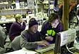 Matthew Ribordy and Yulia Minaeva review data from the Antarctic Muon and Neutrino Detector Array (AMANDA)