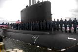 Sailors assigned to the Virginia-class attack submarine Pre-Commissioning Unit California (SSN 781) board the boat as they "bring her to life" during a commissioning rehearsal ceremony the day before the Navy's newest submarine is commissioned.