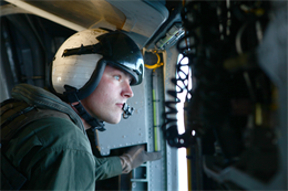 Lance Cpl. Randy Wilson, a CH-53E Super Stallion crew chief with Marine Heavy Helicopter Squadron 465 'Warhorse,' 3rd Marine Aircraft Wing and a Virginia Beach, Va., native looks out of a  Super Stallion before performing helocasting training near Marine Corps Base Camp Pendleton, Calif., Jan. 31. Warhorse supported Charlie Company, 1st Reconnaissance Marines along with Japanese recon and intelligence forces providing aerial transport to their nautical landing point, where the Marines jumped from the aircraft to boat back to land.