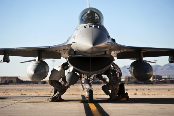 Two dedicated crew chiefs with the Alabama Air National Guard's 187th Fiighter Wing perform post-flight inspections on an F-16 Fighting Falcon prior to the aircraft shut down after a Green Flag-West 13-02 mission at Nellis Air Force Base Nev.