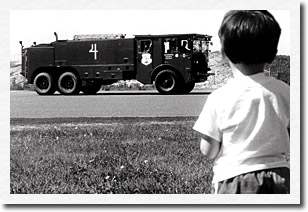 A big truck catches this young man's attention at the 1985 family day celebration. AKANG photo.