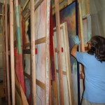 Materials Conservator Jason Church loads a newly constructed paintings rack with water damaged canvas