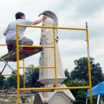 NCPTT Conservator Jason Church looks at deposits of gypsum crusts on the Macomb monument.