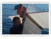 Captain Mike Taetsch deploys a drifter buoy in the Straits of Mackinac. Credit: NOAA