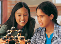 Two girls in science class