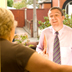 Photo of an untrustworthy man in a senior’s doorway.