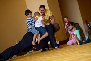 Melvin Kearney, a retired sergeant and AW2 Advocate, took time out during the week to play with toddlers at the AW2 Symposium as a human jungle gym.