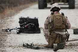 A Marine with 2nd Explosive Ordnance Disposal Company, 2nd Marine Logistics Group prepares to clear a road of possible improvised explosive devices during the company’s predeployment training at Camp Davis, N.C., Feb. 12, 2013. The Marine used a metal detector and knife to clear a path onto the road before placing a simulated explosive meant to destroy additional IEDs.