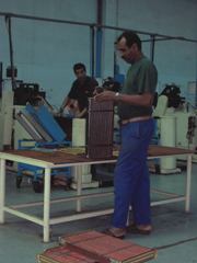 Man with wood in factory