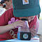 Child looking through a magnifying glass.