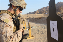 JORDAN (Oct. 3, 2012) Lance Cpl. John Graham, from Southwest city, Mo., assigned to Marine Engagement Team from Battalion Landing Team 1st Battalion, 2nd Marine Regiment, 24th Marine Expeditionary Unit, checks his shot groups after conducting a live fire training exercise, Oct. 3, 2012. The engagement team is a platoon-sized group of Marines from the 24th MEU who are conducting a variety of unilateral and bilateral training events with the Jordanian Marines in southern Jordan. The 24th MEU is deployed with the Iwo Jima Amphibious Ready Group as a U.S. Central Command theater reserve force, providing support for maritime security operations and theater security cooperation efforts in the U.S. 5th Fleet area of responsibility. (U.S. Marine Corps photo by Lance Cpl. Tucker S. Wolf/Released)