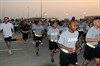 CAMP ARIFJAN, Kuwait (November 11, 2009) - Over 900 Soldiers, Sailors, Airmen, Marines and civilians attached to Third Army at Camp Arifjan, Kuwait, participated in a Veteran’s Day 5k run on Nov. 11, 2009.  The run began at 6 a.m. after a moment of silence was held to honor all those Servicemembers who have served the United States in armed conflicts from World War I to the War on Terrorism, and most recently those killed and wounded during the Ft. Hood shooting of Nov. 5, 2009. Photo by Sgt. Daniel W. Lucas, Third Army PAO, 203rd Public Affairs Detachment.