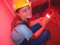 A young woman from Zvornik in north-east Bosnia-Herzegovina is using a blower door and meter to measure air leakages to determine weatherization strategies in a rural house for the upcoming winter.