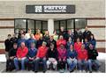 Employees of Patton Electronics Company together with co-owner Bobby Patton (center) (Photo Patton Electronics Co.)