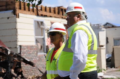 Billy hears about the process for removing debris from homes from U.S. Army Corps of Engineers quality assurance supervisor Kevin Baily.