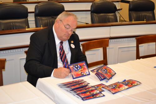 November 28, 2012- Billy signs Christmas cards for service members, veterans and their families during the annual American Red Cross Holiday Mail for Heroes program.  