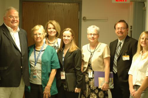 Billy stands with employees of the Mt. Vernon Community Based Outpatient Clinic