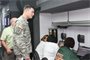 District Engineer, Lieutenant Colonel Chamberlayne monitors unfolding events and activities during the District Hurricane exercise.