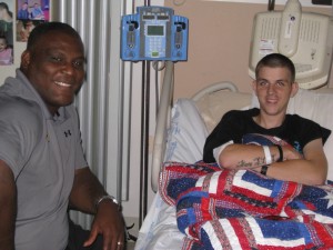 COL Greg Gadson, Director, Army Wounded Warrior Program, visits with CPL Jeremy D. Voels during a visit to the James A. Haley VA Hospital, Tampa, FL.