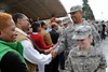 CAMP ARIFJAN, Kuwait (December 23, 2009) - Servicemembers thank sponsors of Operation Thanksgiving - Christmas at Camp Arifjan, Kuwait on Dec. 23.  The event, sponsored by Third Army, the Gittens Family, and local businesses is meant to benefit the morale of troops deployed during the holiday season so they can sustain the fight.  Third Army utilized logistic capabilities for delivering thousands of stockings full of gifts to servicemembers throughout the region this year. Photo by Army Spc. Monte Swift, 203rd PAD, Third Army PAO.