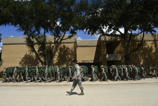 Staff Sgt. Joshua Power marches his flight after their initial haircut and clothing issue.