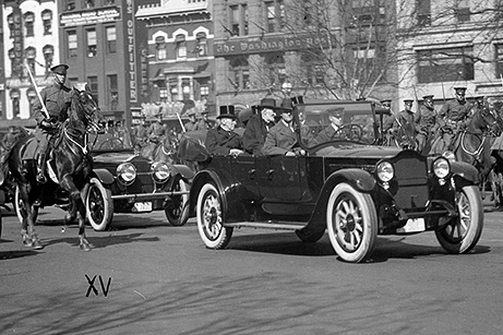 President-elect Warren Harding and outgoing President Woodrow Wilson ride together in the backseat of an automobile in 1921- the first time a car was used in the Procession to the Capitol.