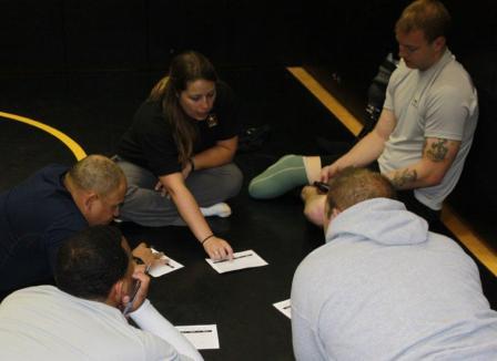 Comprehensive Soldier Fitness-Performance and Resilience Enhancement Program (CSF-PREP) performance specialist Kaitlyn Donohoe, works with Army track and field athletes at the 2011 Warrior Games.