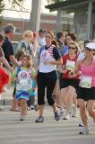 Staff Sgt. Mandi Hagen, ND Air National Guard, and her daughter run a Fargo Marathon event with the TAPS Run & Remember Team. The TAPS team is running in memory of military service members who died while in service to our country.