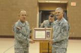 Maj. Gen. David Sprynczynatyk, adjutant general, presents the Meritorious Service Medal to Master Sgt. Al Peterson during Peterson’s retirement ceremony. Peterson is the last Vietnam War veteran serving in the NDNG. 