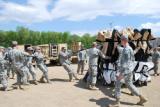 Soldiers of the ND National Guard's 141st Maneuver Enhancement Brigade (MEB) erect a Command Post Platform, a series of climate-controlled field tents that house command staff members and high-tech equipment.  (Photo by Spc. Jose Toribio, 141st MEB)