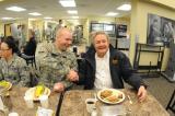 Gov. Jack Dalrymple shakes hands with Spc. Sean Johnson during a break from flood duty at the N.D. Air National Guard’s dining facility in Fargo. (Photo by Senior Master Sgt. David H. Lipp)