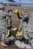 Members of the North Dakota National Guard 815th Engineer Company, including Sgt. Craig Miller, right, are responding to a flood-related emergency at a sandbagging location in Fargo, N.D. (Photo by Senior Master Sgt. David H. Lipp)