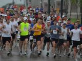 Tech. Sgt. Sam Ruiz, of the 119th Security Forces Squadron, (grey tank-top and white headband) can be seen running in the middle of the pack at about the 8-mile mark May 22, during the 2010 Fargo Marathon.