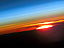 ISS015-E-10469 --- The profile of the atmosphere and a setting sun