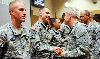 Brig. Gen. Donald MacWillie, senior commander, Fort Riley, second from right, congratulates Sgt. Michael Sanford, 1st Bn., 16th Inf. Regt., 1st ABCT, second from left, after an Oct. 26 ceremony at Fort Riley naming him the 1st Inf. Div. NCO of the Quarter. Pfc. Christopher Leheney, 4th Sqdn., 4th Cav. Regt., 1st ABCT, left, was named the Soldier of the Quarter.  Photo by: Amanda Kim Stairrett, 1ST INF. DIV.