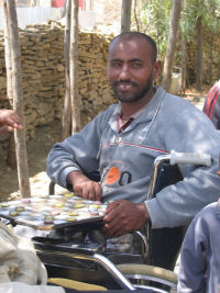 smiling man in wheelchair