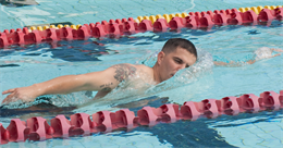 Sgt. Daniel Brown, a radio operator with 3rd Marine Regiment, swims laps at the base pool, Feb. 6, 2013. Brown is competing in the Semper Fit Center’s Try-Athlon this month, swimming 2.4 miles, biking 112 miles and running 26.2 miles at his own pace — the equivalent of an Ironman triathlon — during the month of February. (U.S. Marine Corps photo by Kristen Wong)