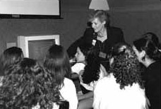 A volunteer orients a group to the Wexner Learning Center