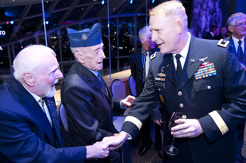 U.S. Army Major General Mathews greets USMC and USAF veterans.