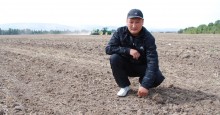 Kanybek Imankulov applies no-till land cultivation on his field. 