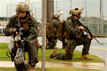 Marines and Sailors from Maritime Raid Force of the 31st Marine Expeditionary Unit post security around the target building after completing a time sensitive raid here, Jan 7. The MRF is comprised of a security element from Battalion Landing Team 1st Battalion, 5th Marine Regiment, Force Reconnaissance Platoon, and the Amphibious Reconnaissance Platoon, 31st MEU. The 31st MEU is the only continuously forward-deployed MEU and is the Marine Corps’ force in readiness in the Asia-Pacific region.