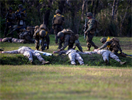 Marines and Sailors of Company A., Battalion Landing Team 1st Battalion, 5th Marine Regiment, 31st Marine Expeditionary Unit, collect simulated enemy casualties and weapons during a mechanized raid here, Jan 11. The raid was part of the 31st MEU’s pre-deployment training for the Spring Patrol 2013, where the Marines and Sailors are scheduled to participate in Exercise Cobra Gold, an annual multi-lateral exercise. The 31st MEU is the only continuously forward-deployed MEU and is the Marine Corps’ force in readiness in the Asia-Pacific region.