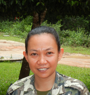 This is a photo of Santi, the first female wildlife enforcement ranger in Thailand. 