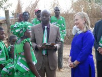 Secretary Clinton With the Lumbadzi Milk Bulking Group in Malawi  Dairy farmer Margaret Chinkwende explains her work to U.S. Secretary of State Hillary Rodham Clinton and Martin Banda of the U.S. Agency for International Development (USAID) in Lilongwe, Malawi, August 5, 2012. Photo Credit: State Department photo/ Public Domain]