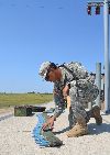 Pfc. Luis Garcia, Co. E, 1st Bn., 63rd Armor Regt., counts 25-millimeter ammunition Aug. 9 at Fort Riley’s Douthit Multi-Purpose Range Complex. (U.S. Army photo by Sgt. Daniel Stoutamire, 2ABCT PAO)

